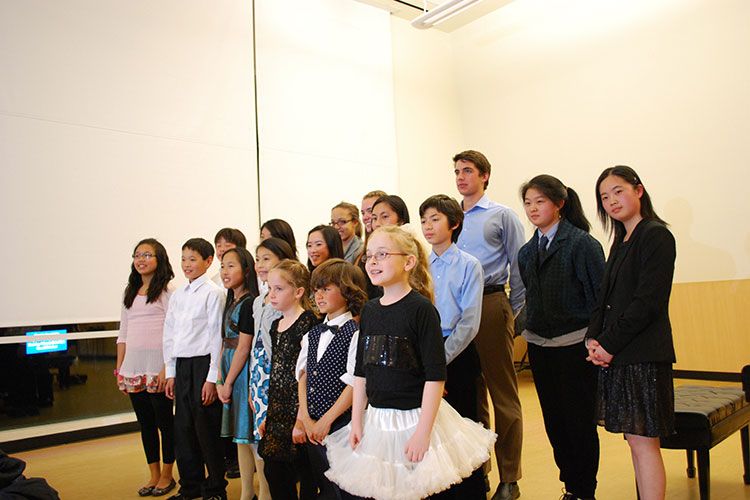 group of music students on stage